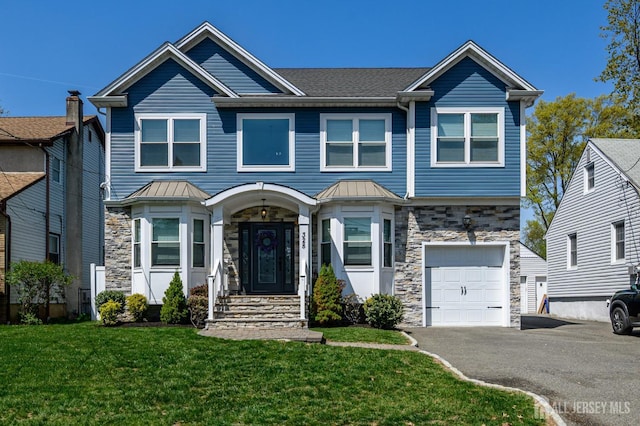 328 Coolidge Dr, Kenilworth, NJ 07033 - view of front of home with stone siding, a garage, a front lawn, and driveway