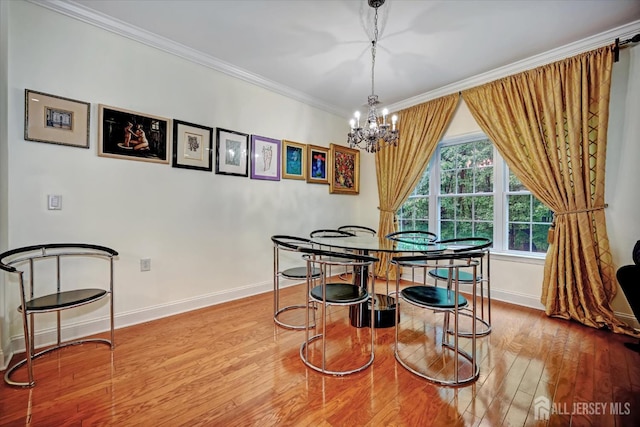 7102 Falston Cir, Old Bridge, NJ 08857 - dining area featuring wood finished floors, a chandelier, and crown molding