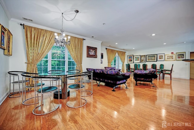 7102 Falston Cir, Old Bridge, NJ 08857 - dining room with a chandelier, ornamental molding, plenty of natural light, wood finished floors, and recessed lighting