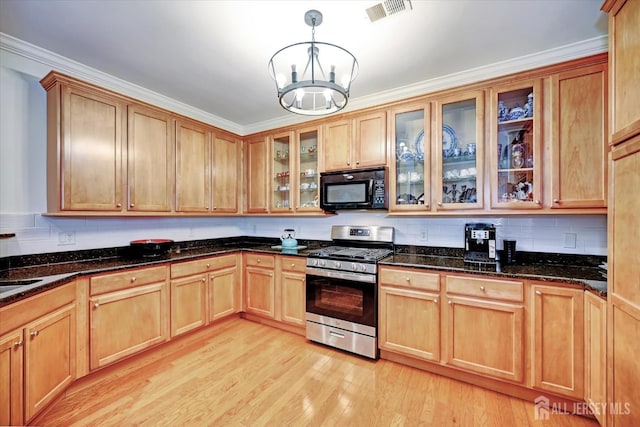 7102 Falston Cir, Old Bridge, NJ 08857 - kitchen with black microwave, stainless steel gas range oven, light wood-style floors, decorative backsplash, and crown molding