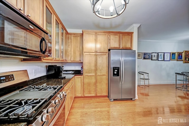 7102 Falston Cir, Old Bridge, NJ 08857 - kitchen featuring stainless steel appliances, tasteful backsplash, light wood finished floors, crown molding, and glass insert cabinets