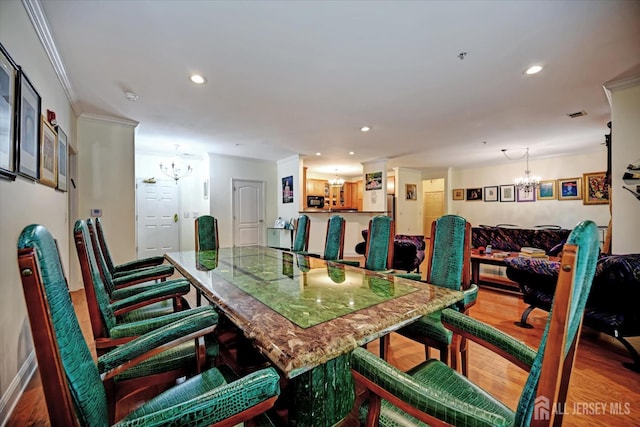 7102 Falston Cir, Old Bridge, NJ 08857 - dining space with a chandelier, wood finished floors, recessed lighting, and crown molding