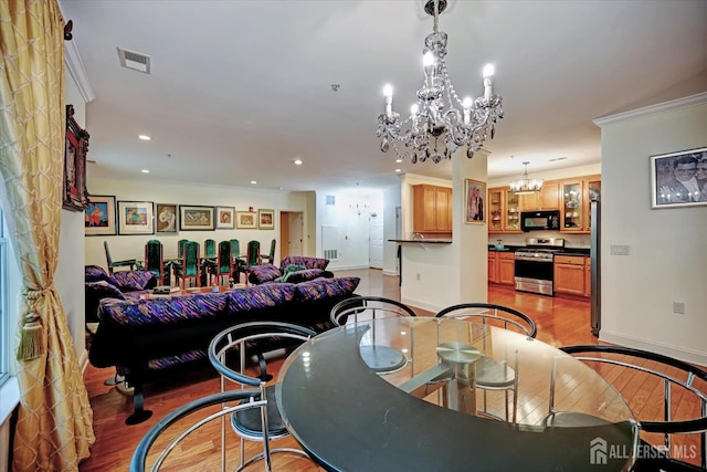 7102 Falston Cir, Old Bridge, NJ 08857 - dining area with a chandelier, ornamental molding, recessed lighting, and light wood-type flooring