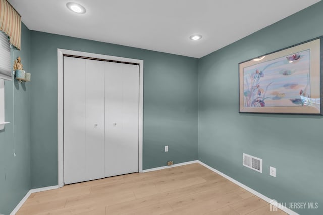 11 Diana Ct, East Brunswick, NJ 08816 - unfurnished bedroom featuring light wood-style floors, baseboards, recessed lighting, and a closet