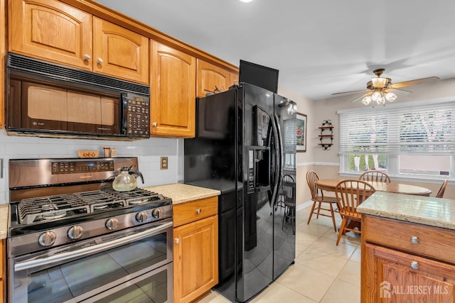 11 Diana Ct, East Brunswick, NJ 08816 - kitchen featuring black appliances, backsplash, light stone counters, and light tile patterned flooring
