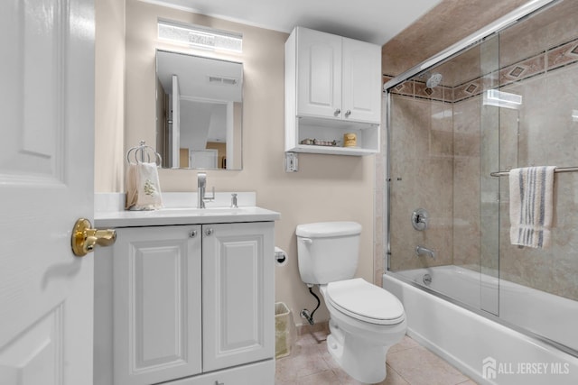 11 Diana Ct, East Brunswick, NJ 08816 - bathroom featuring toilet, vanity, tile patterned flooring, and bath / shower combo with glass door