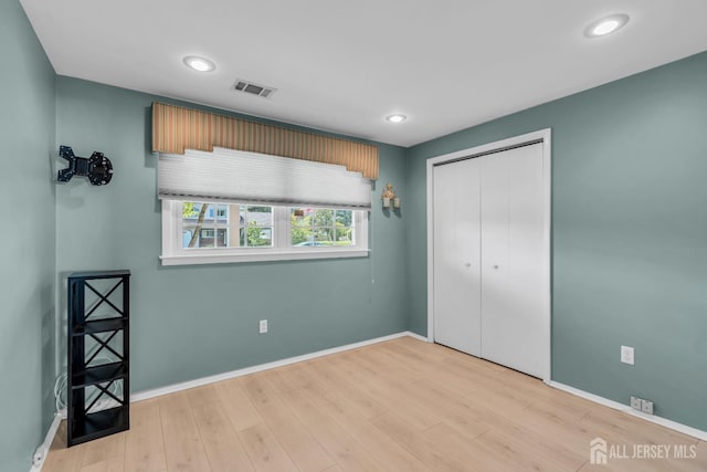 11 Diana Ct, East Brunswick, NJ 08816 - unfurnished bedroom with light wood finished floors, baseboards, recessed lighting, and a closet