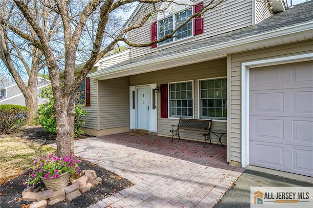 13 Harper Rd, South Brunswick, NJ 08852 - property entrance with a garage and roof with shingles