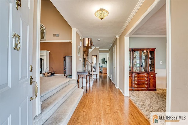 13 Harper Rd, South Brunswick, NJ 08852 - foyer featuring stairway, light wood finished floors, crown molding, and baseboards