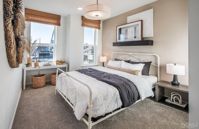 carpeted bedroom with baseboards