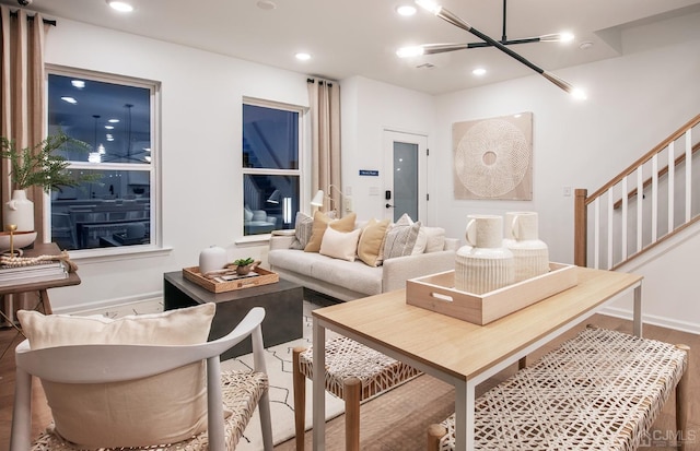 living room with stairway, recessed lighting, and wood finished floors