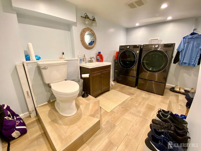 22 E Zoller Rd, East Brunswick, NJ 08816 - full bathroom with independent washer and dryer, wood finished floors, recessed lighting, toilet, and baseboards