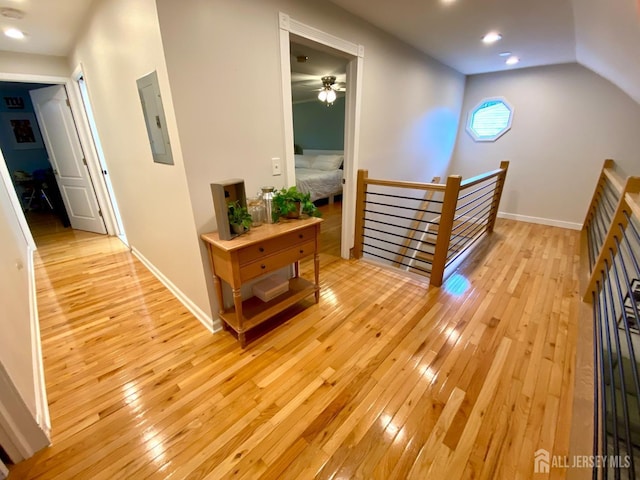 22 E Zoller Rd, East Brunswick, NJ 08816 - hallway with an upstairs landing, electric panel, light wood-style flooring, baseboards, and recessed lighting