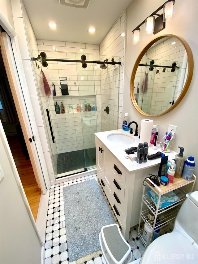 22 E Zoller Rd, East Brunswick, NJ 08816 - full bathroom with a stall shower, vanity, toilet, and recessed lighting