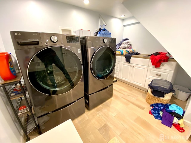 22 E Zoller Rd, East Brunswick, NJ 08816 - laundry area with washer and clothes dryer, light wood-type flooring, cabinet space, and recessed lighting