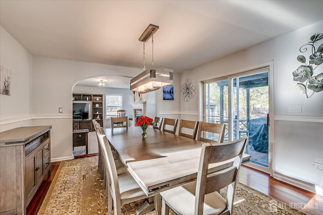 74 Gates Rd, Franklin, NJ 08873 - dining space featuring arched walkways and dark wood-type flooring
