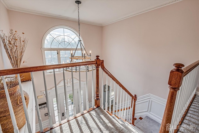 74 Gates Rd, Franklin, NJ 08873 - stairs featuring a high ceiling, an inviting chandelier, a decorative wall, a wainscoted wall, and ornamental molding