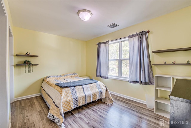 74 Gates Rd, Franklin, NJ 08873 - bedroom with baseboards, wood finished floors, and visible vents