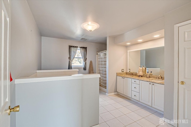 74 Gates Rd, Franklin, NJ 08873 - full bath with visible vents, a sink, tile patterned flooring, and double vanity