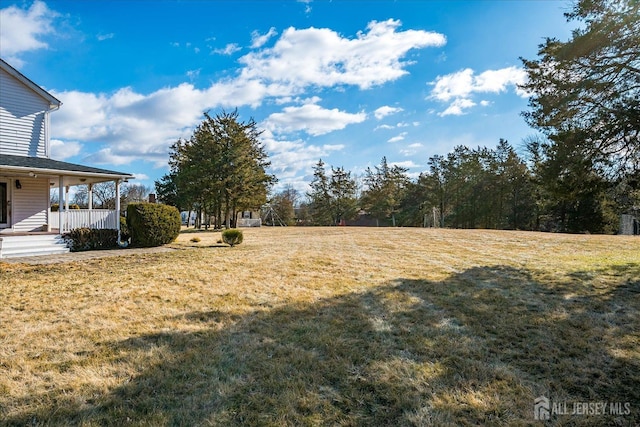 74 Gates Rd, Franklin, NJ 08873 - view of green lawn featuring covered porch