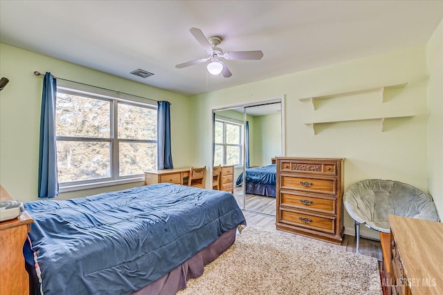 74 Gates Rd, Franklin, NJ 08873 - bedroom with visible vents, a closet, baseboards, ceiling fan, and light wood-style flooring