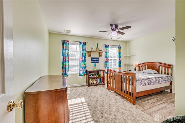 74 Gates Rd, Franklin, NJ 08873 - bedroom featuring baseboards, a ceiling fan, wood finished floors, and visible vents