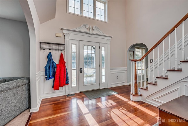 74 Gates Rd, Franklin, NJ 08873 - entrance foyer with a wealth of natural light, wood finished floors, and a wainscoted wall