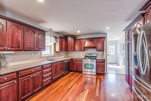 74 Gates Rd, Franklin, NJ 08873 - kitchen featuring a sink, premium range hood, a wealth of natural light, and stainless steel appliances