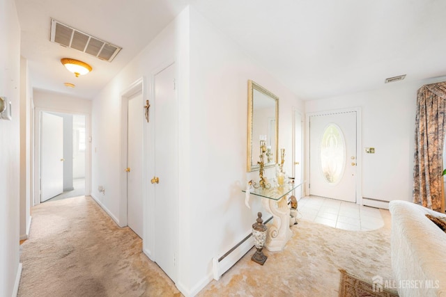 15 E Grant Ave, Colonia, NJ 07067 - foyer entrance with light carpet and baseboards