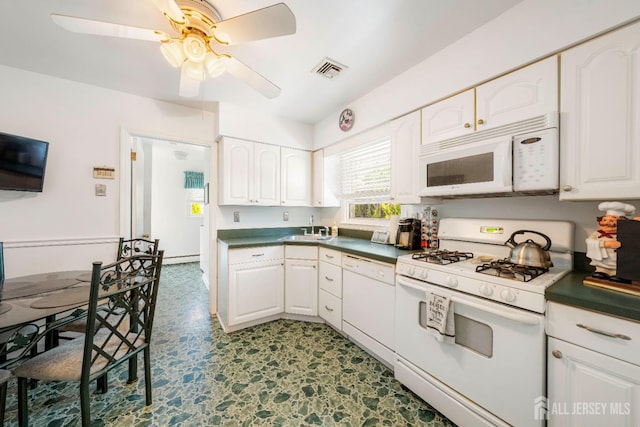 15 E Grant Ave, Colonia, NJ 07067 - kitchen featuring white appliances, a ceiling fan, white cabinets, dark countertops, and tile patterned floors