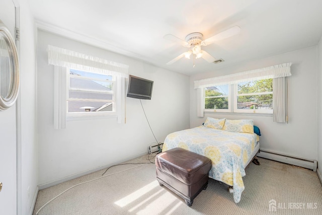 15 E Grant Ave, Colonia, NJ 07067 - carpeted bedroom with a baseboard heating unit and ceiling fan