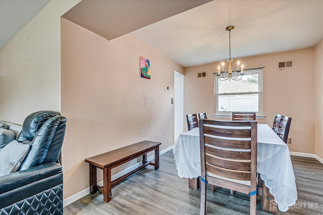 40 Azalea Dr, Edison, NJ 08820 - dining space with a chandelier, wood finished floors, and baseboards