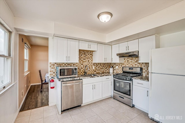40 Azalea Dr, Edison, NJ 08820 - kitchen with stainless steel appliances, under cabinet range hood, white cabinetry, and a sink