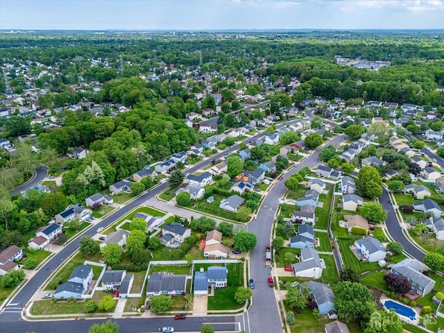 aerial view of property and surrounding area with nearby suburban area