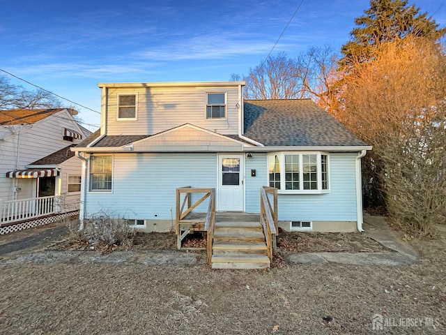 view of front of house featuring a shingled roof