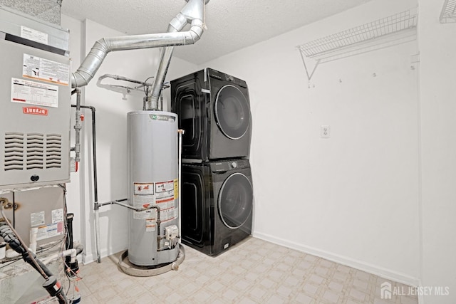 utilities featuring stacked washer / dryer and gas water heater