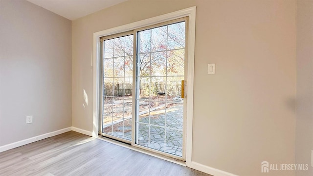 126 Jefferson Ln, Little Egg Harbor, NJ 08087 - doorway to outside with wood finished floors and baseboards