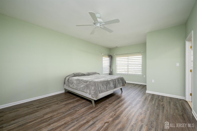 236 Valencia Dr, Monroe, NJ 08831 - bedroom with baseboards, a ceiling fan, and dark wood-type flooring