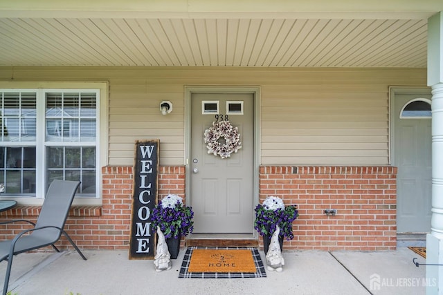 938 Thomas Ave, North Brunswick, NJ 08902 - entrance to property featuring brick siding and a porch
