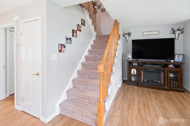 938 Thomas Ave, North Brunswick, NJ 08902 - stairway with wood finished floors and baseboards