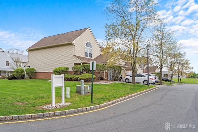 938 Thomas Ave, North Brunswick, NJ 08902 - view of property exterior with a lawn and a shingled roof