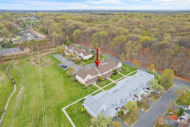 938 Thomas Ave, North Brunswick, NJ 08902 - aerial view of property and surrounding area featuring a forest and nearby suburban area