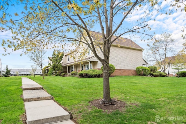 938 Thomas Ave, North Brunswick, NJ 08902 - view of front facade with a front yard