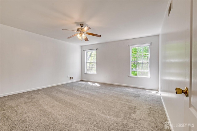 230 S 10th Ave S, Highland Park, NJ 08904 - spare room with healthy amount of natural light, carpet flooring, ceiling fan, and baseboards