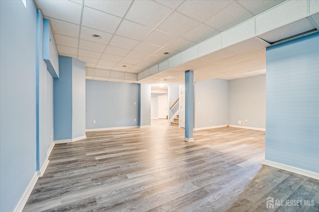 230 S 10th Ave S, Highland Park, NJ 08904 - finished basement with a drop ceiling, stairs, wood finished floors, and baseboards