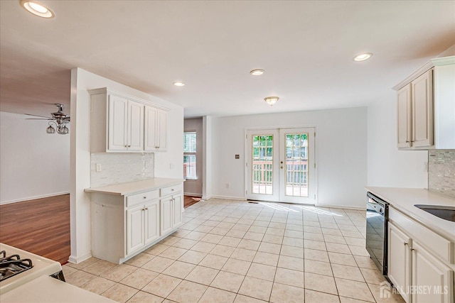 230 S 10th Ave S, Highland Park, NJ 08904 - kitchen featuring black dishwasher, decorative backsplash, light countertops, baseboards, and recessed lighting