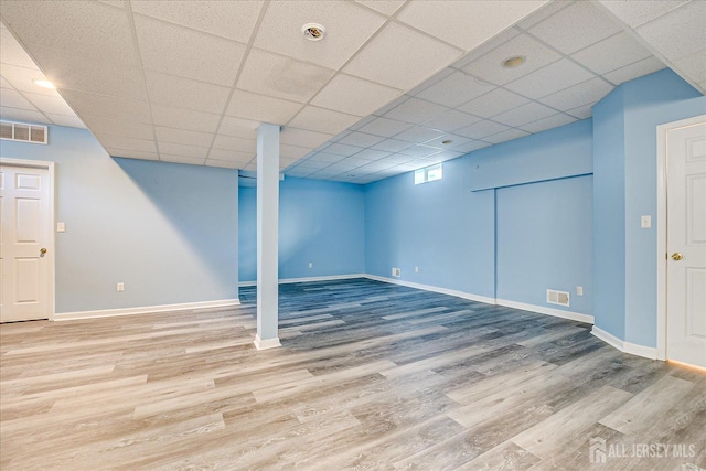 230 S 10th Ave S, Highland Park, NJ 08904 - basement featuring wood finished floors, baseboards, and a paneled ceiling