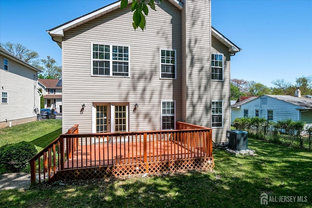 230 S 10th Ave S, Highland Park, NJ 08904 - rear view of house featuring central air condition unit, a wooden deck, and a chimney