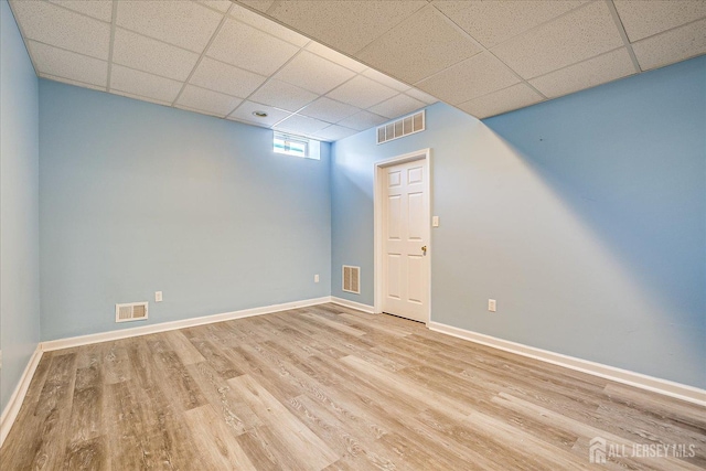 230 S 10th Ave S, Highland Park, NJ 08904 - basement with wood finished floors, a paneled ceiling, and baseboards