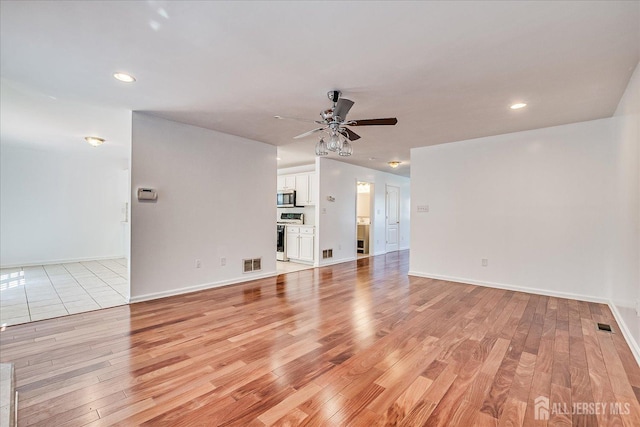 230 S 10th Ave S, Highland Park, NJ 08904 - unfurnished living room featuring light wood finished floors, ceiling fan, recessed lighting, and baseboards